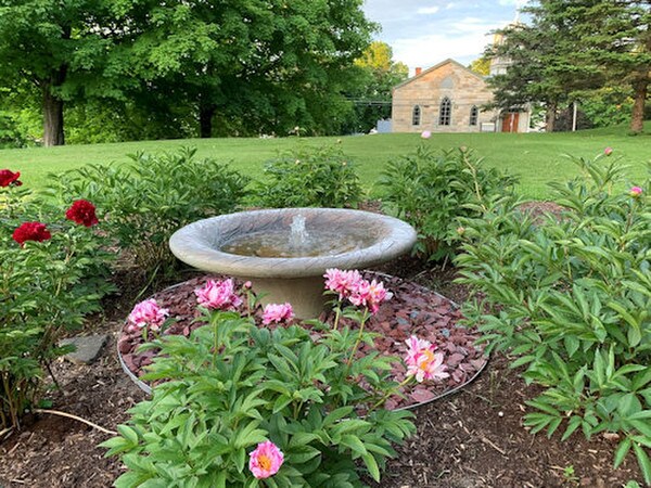 Shown in outdoor setting our exquisite leaf motif garden fountain round